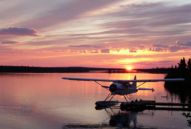 View of Float Plane at the Dock at Misaw Lake Lodge at Sunset